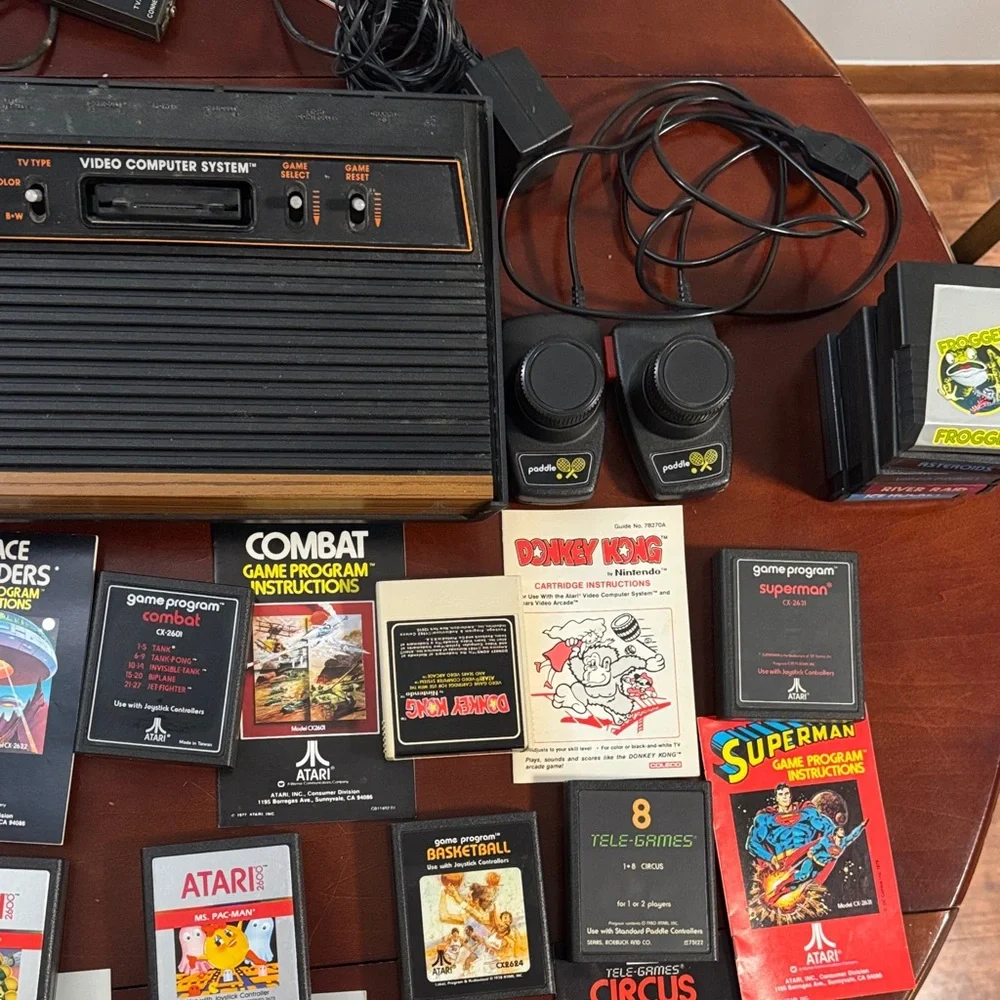 Vintage Authentic Atari 2600 with controllers, games and instruction booklets.